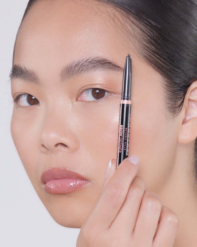 Applying Brow Definer in Granite and Brow Freeze® Gel