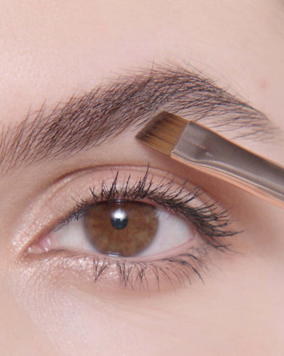 Applying Brow Powder Duo in Dark Brown