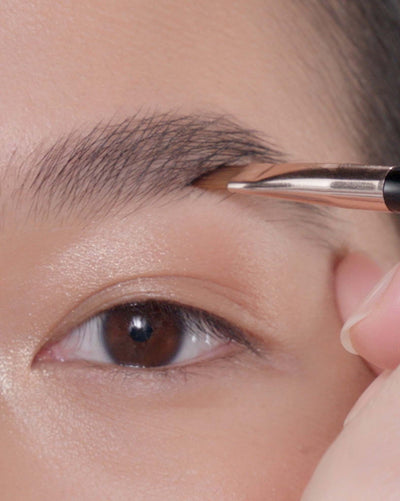 Applying Brow Powder Duo in Granite